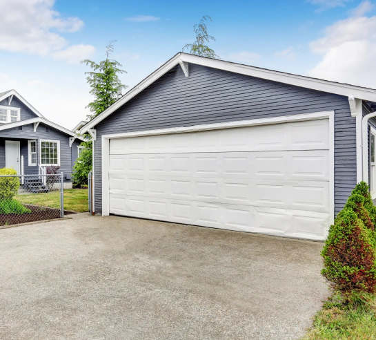 garage with concrete driveway